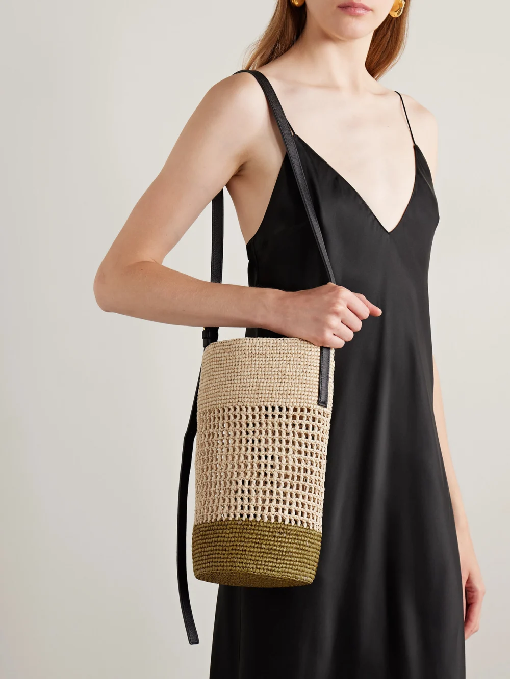 Khaite Billie Leather-trimmed Two-tone Raffia Bucket Bag, styled view