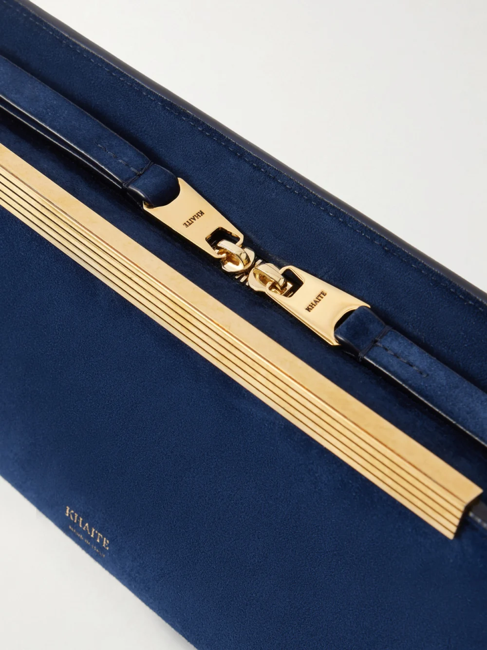 Close-up detail of the Khaite Donna Suede Clutch
