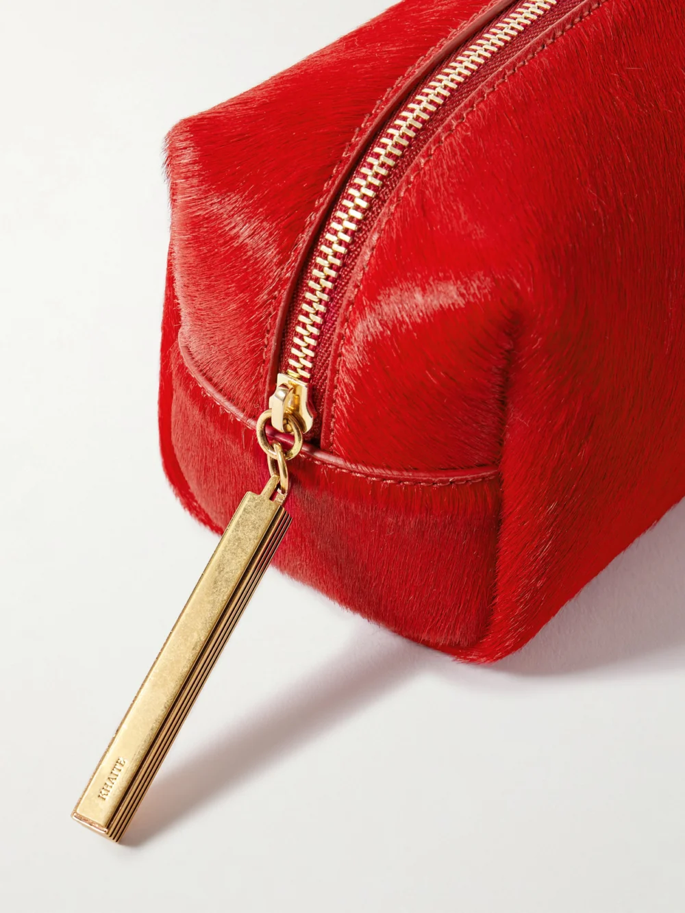 Close-up detail of the Khaite Kye Calf Hair Clutch