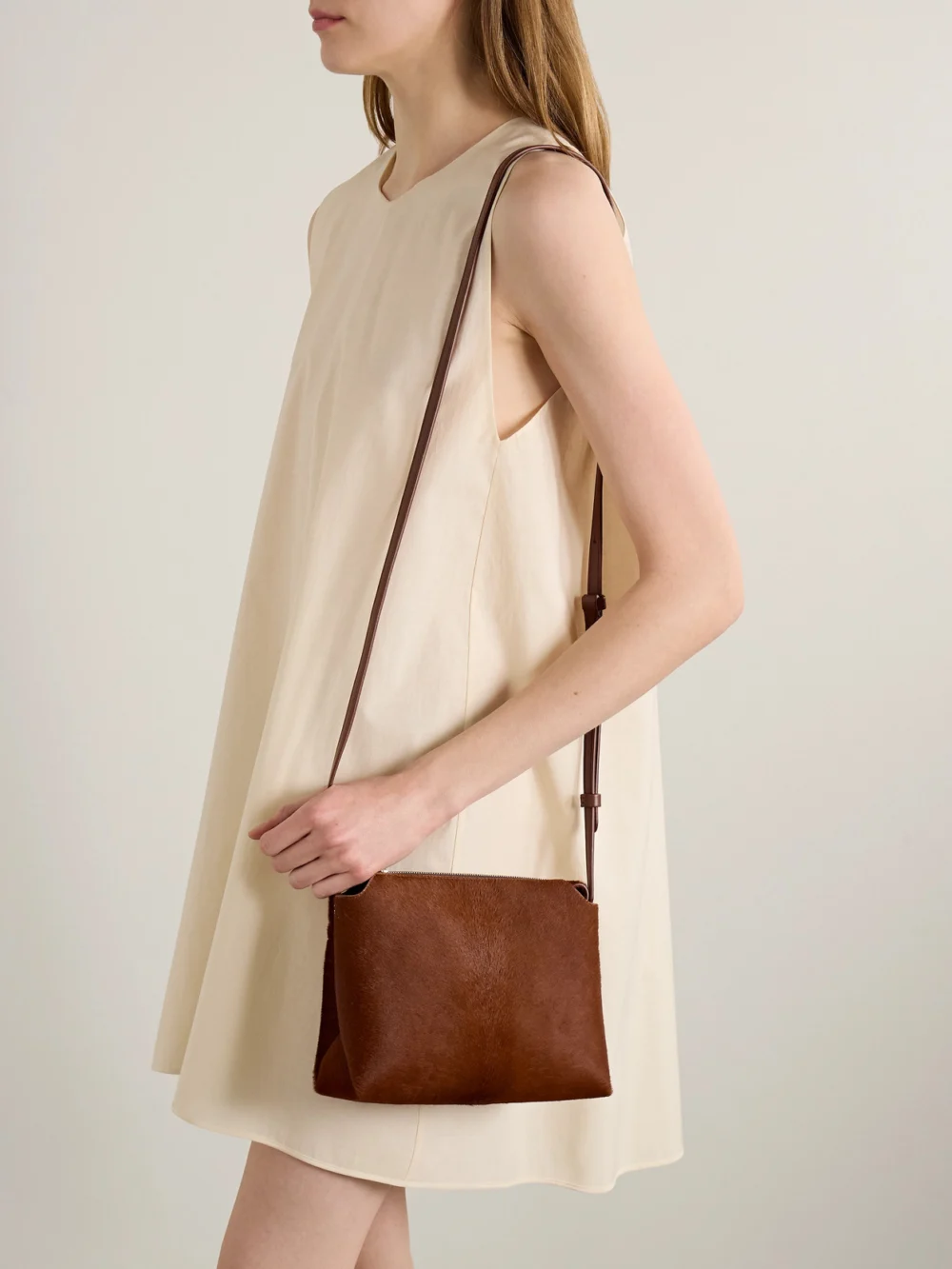 Khaite Lina Medium Calf Hair Shoulder Bag, styled view