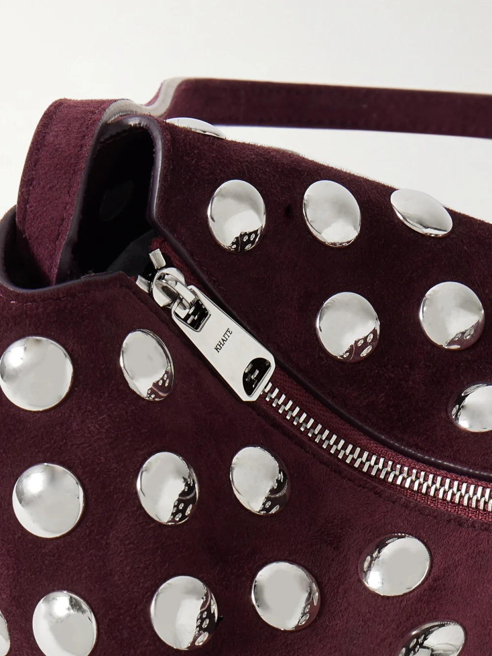 Close-up detail of the Khaite Lina Medium Studded Suede Shoulder Bag