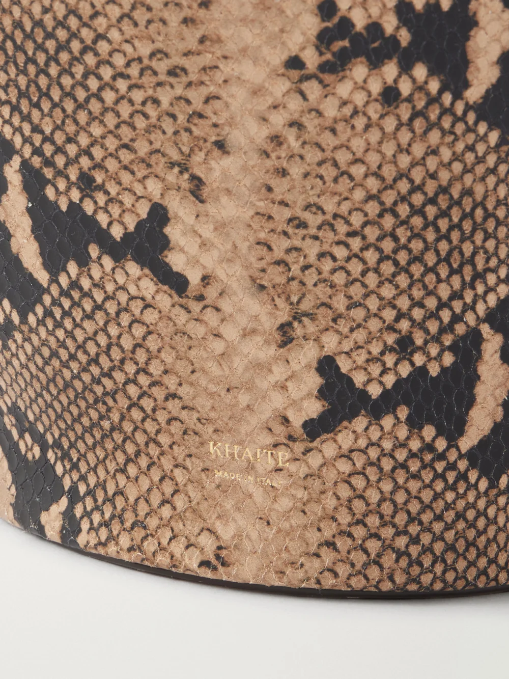 Close-up detail of the Khaite Lotus Small Suede-trimmed Snake-effect Leather Tote
