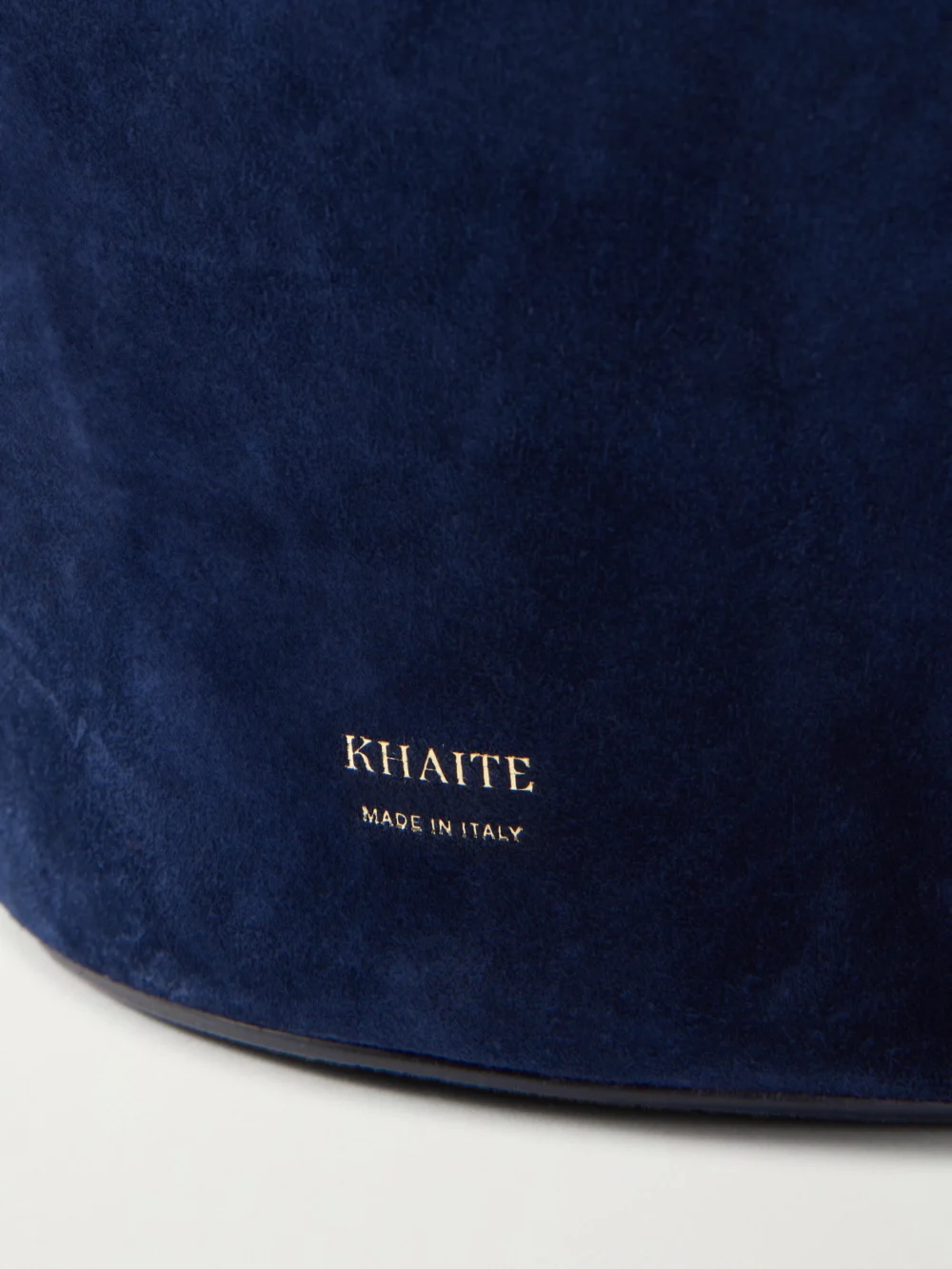 Close-up detail of the Khaite Lotus Suede Shoulder Bag