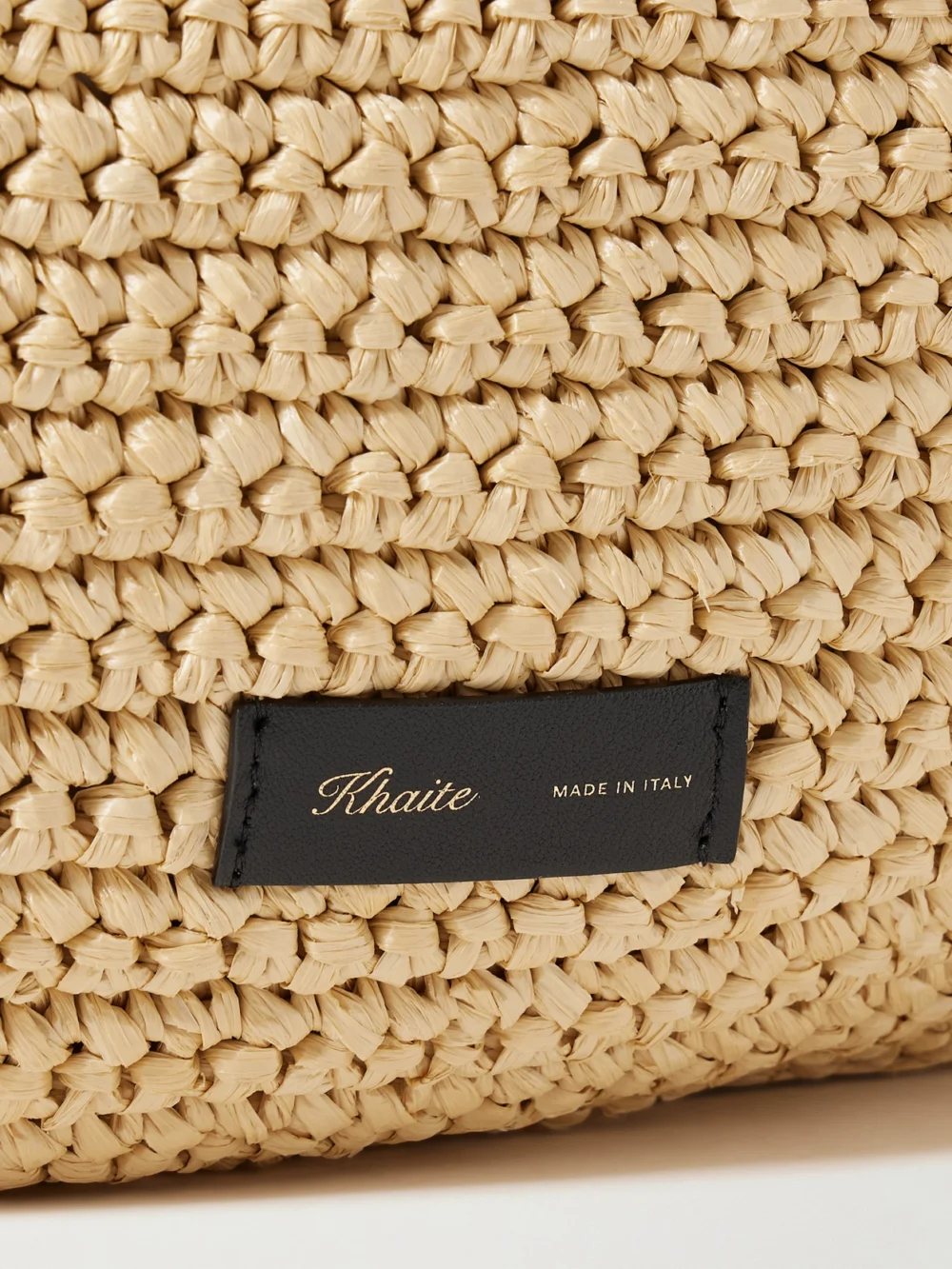 Close-up detail of the Khaite Olivia Large Raffia Shoulder Bag