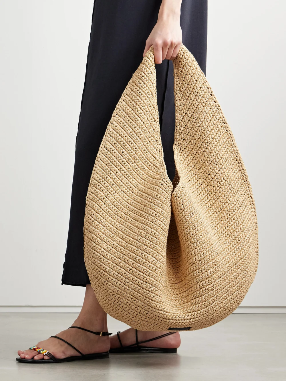 Khaite Olivia Large Raffia Shoulder Bag, styled view
