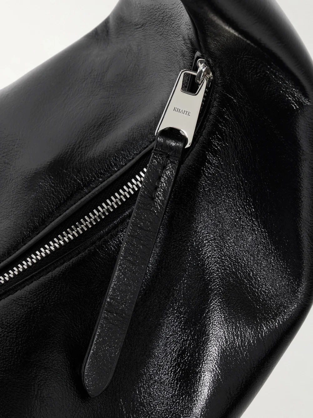 Close-up detail of the Khaite Olivia Medium Crinkled Patent-leather Tote