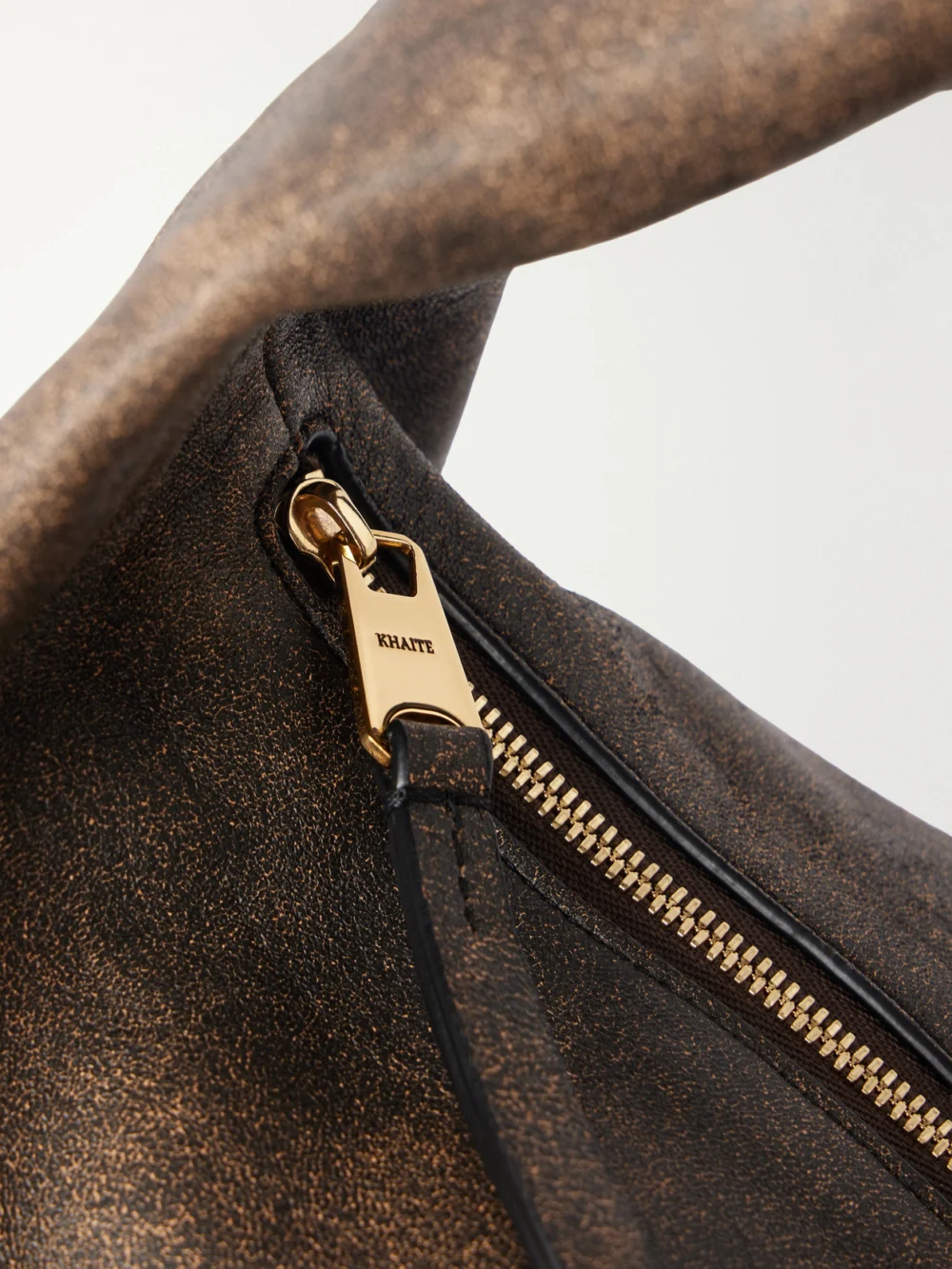 Close-up detail of the Khaite Olivia Medium Distressed Leather Shoulder Bag