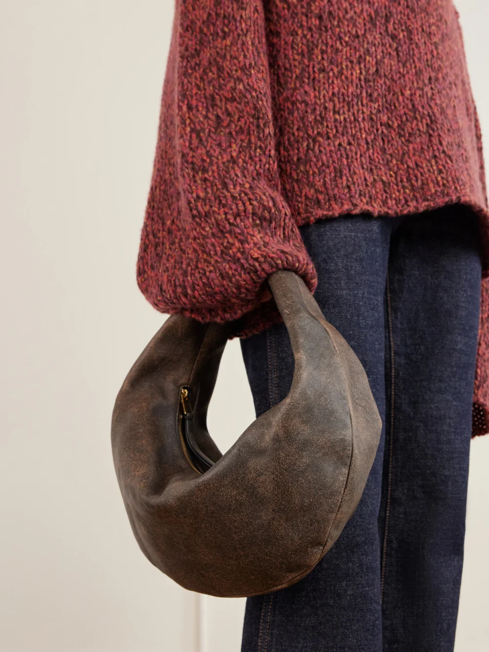 Khaite Olivia Medium Distressed Leather Shoulder Bag, styled view