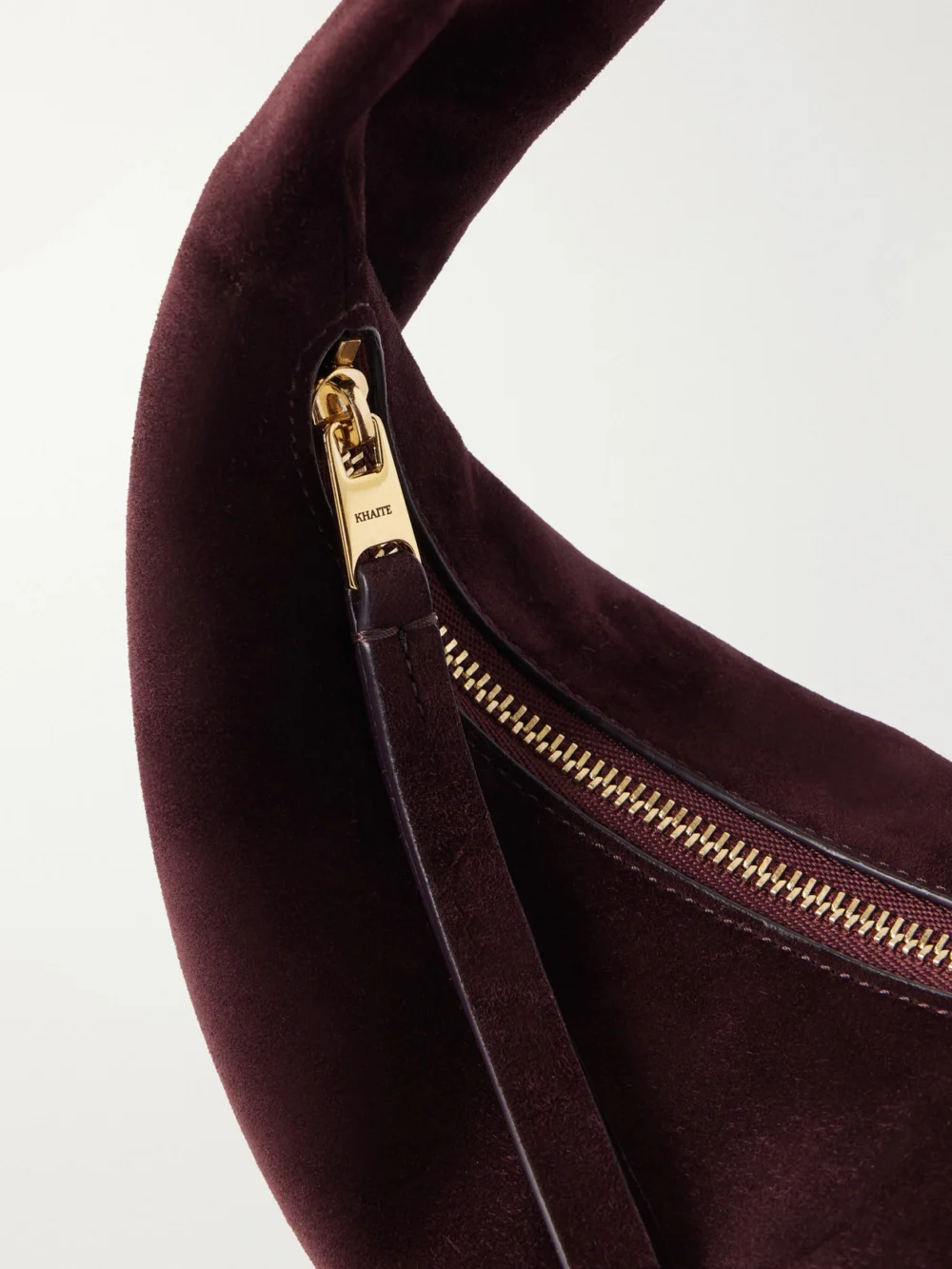 Close-up detail of the Khaite Olivia Mini Suede Top-handle Bag