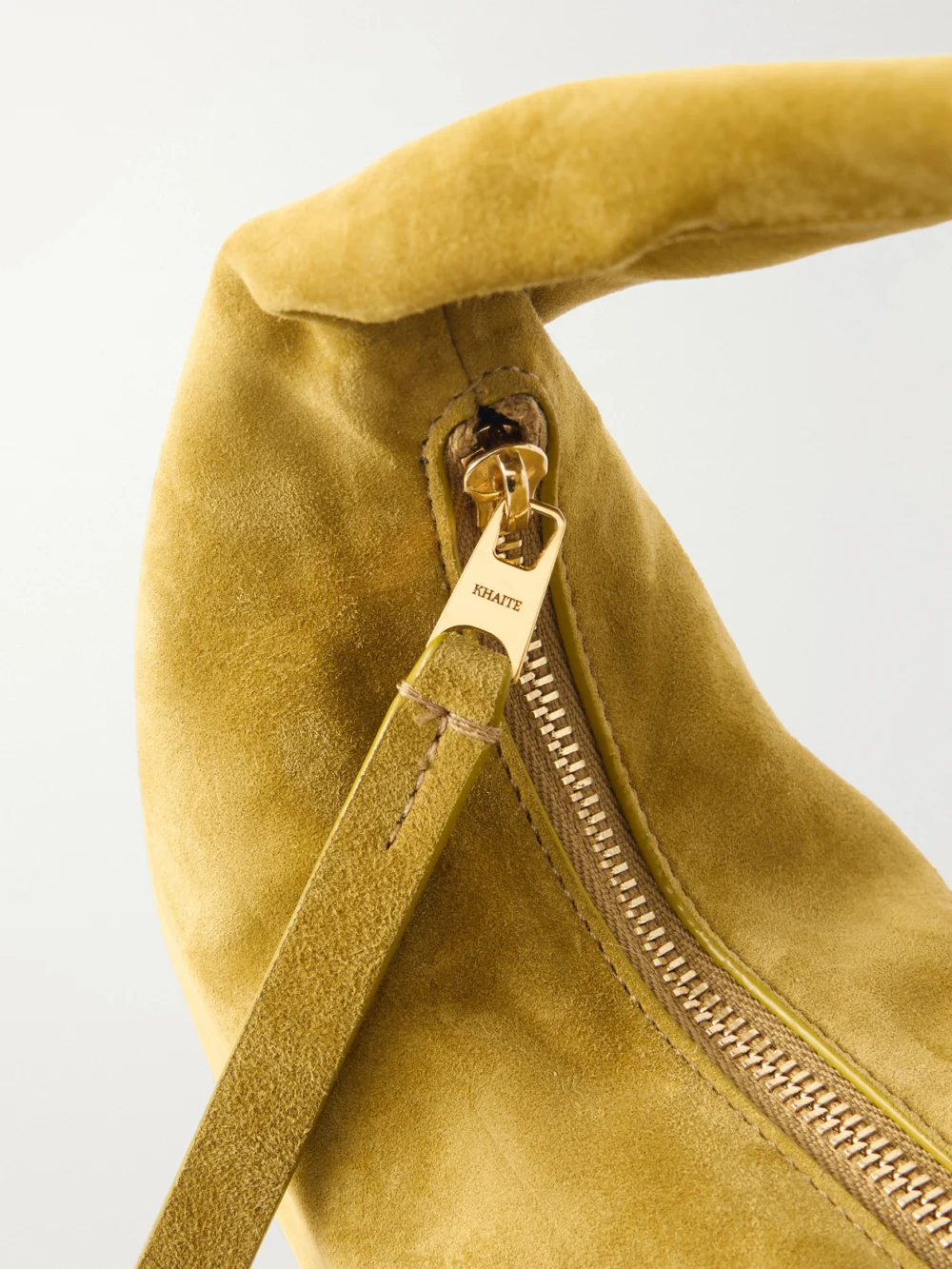 Close-up detail of the Khaite Olivia Mini Suede Top-handle Bag
