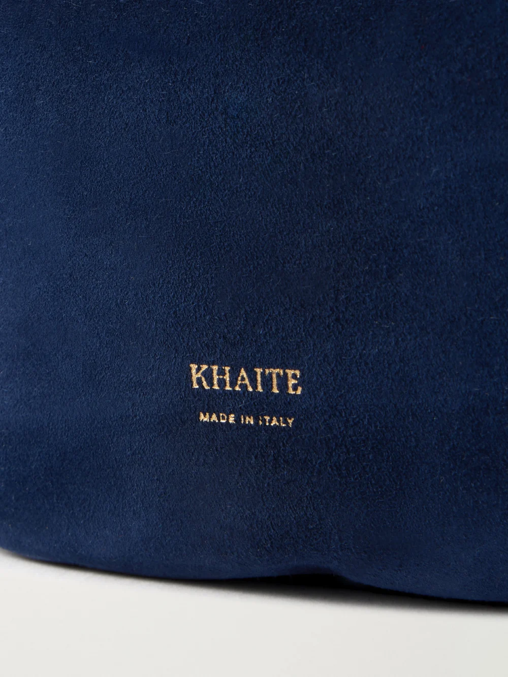 Close-up detail of the Khaite Olivia Mini Suede Top-handle Bag