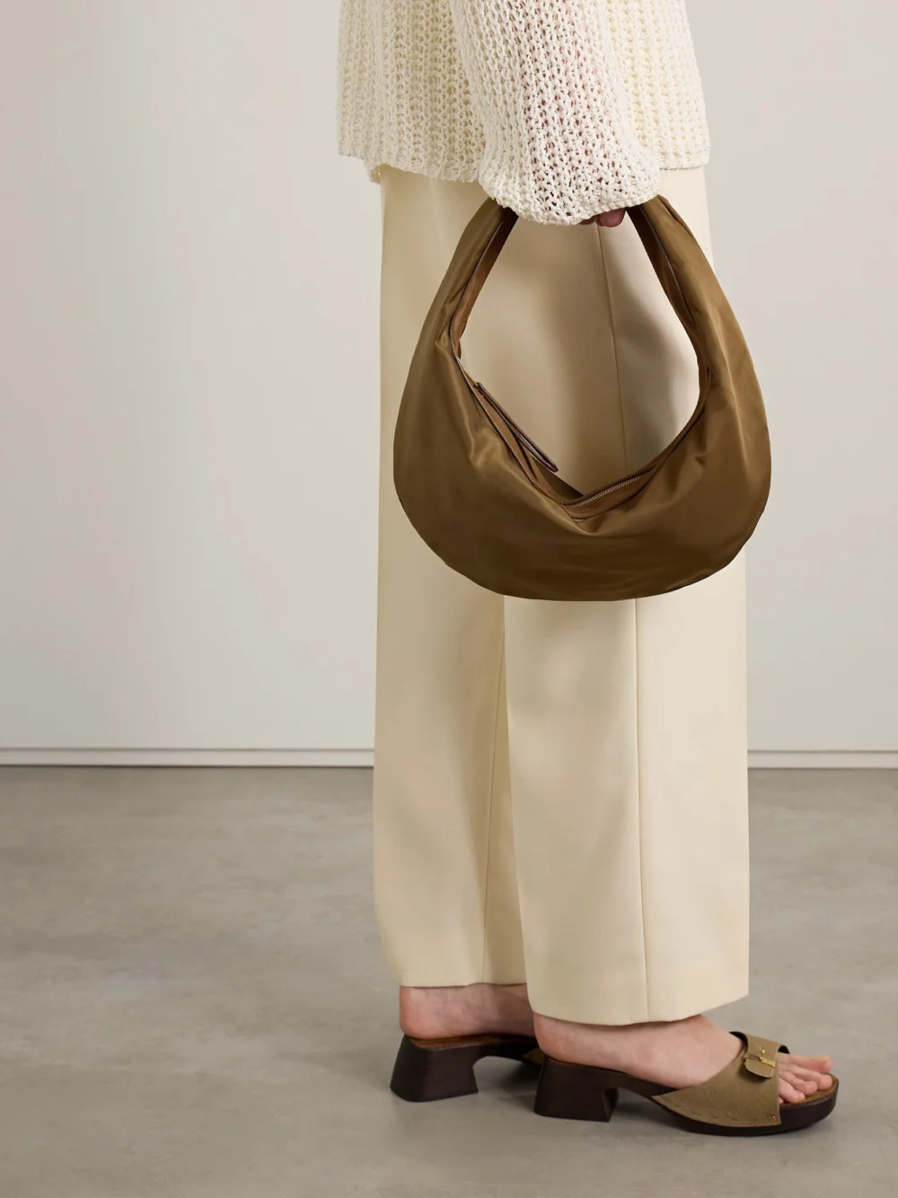 Khaite Olivia Sport Medium Suede-trimmed Shell Shoulder Bag, styled view