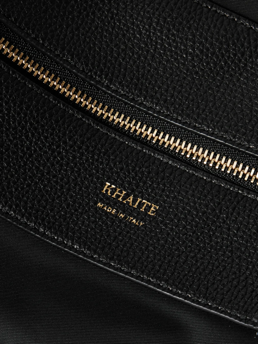Close-up detail of the Khaite Olivia Sport Medium Textured Leather-trimmed Shell Shoulder Bag