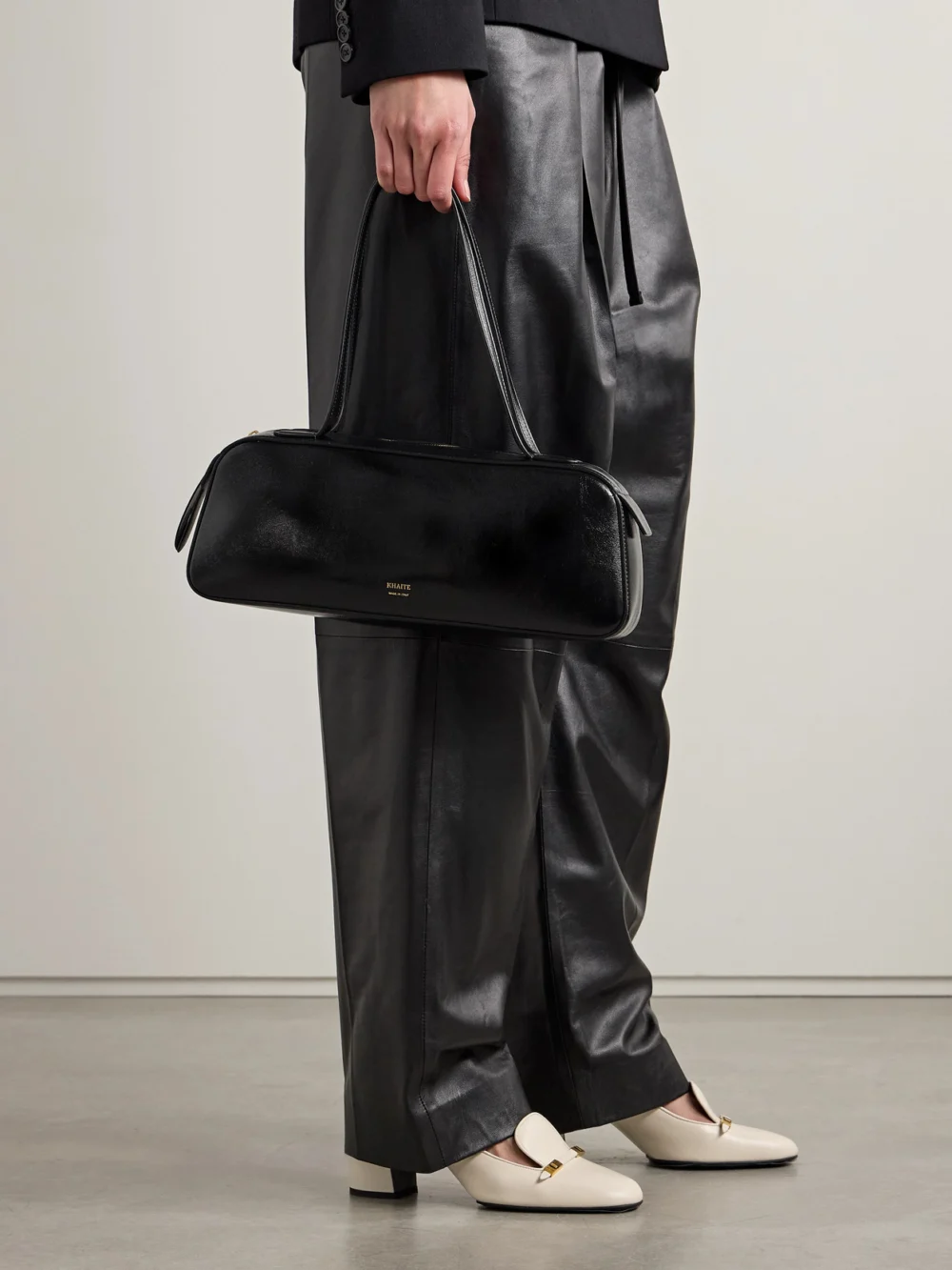 Khaite Simona Glossed-leather Shoulder Bag, styled view