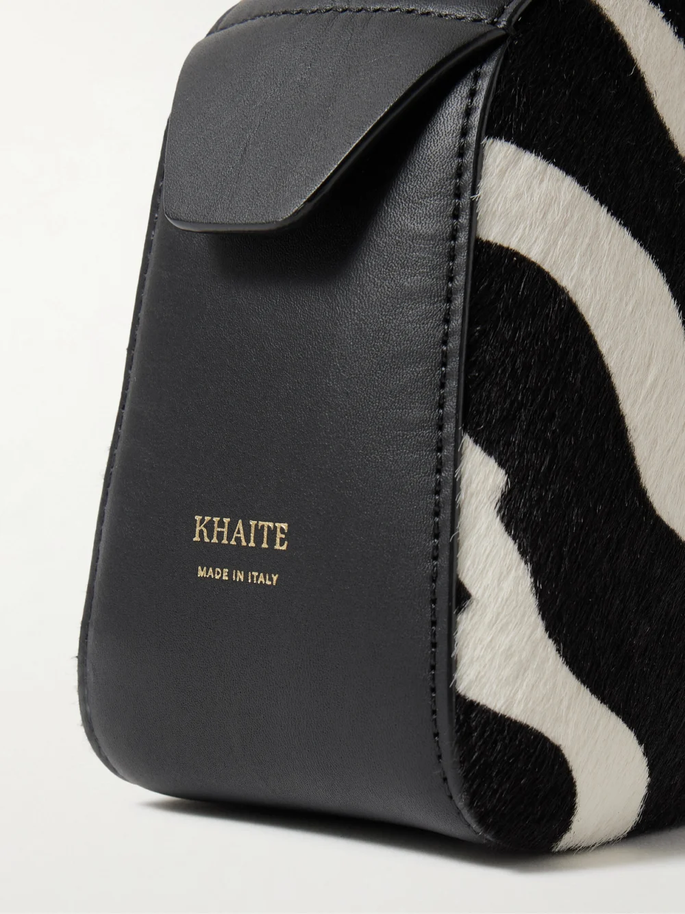 Close-up detail of the Khaite Simona Leather-trimmed Zebra-print Calf Hair Shoulder Bag