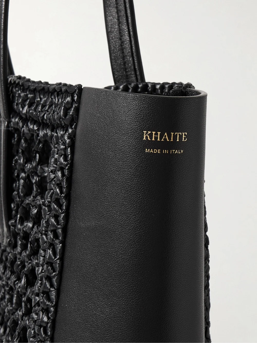 Close-up detail of the Khaite Zoe Small Leather and Raffia Tote