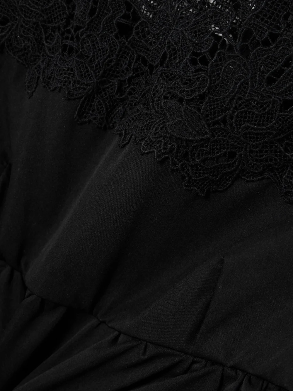 Close-up detail of the Kika Vargas Ivonne Guipure Lace-trimmed Twill Peplum Top