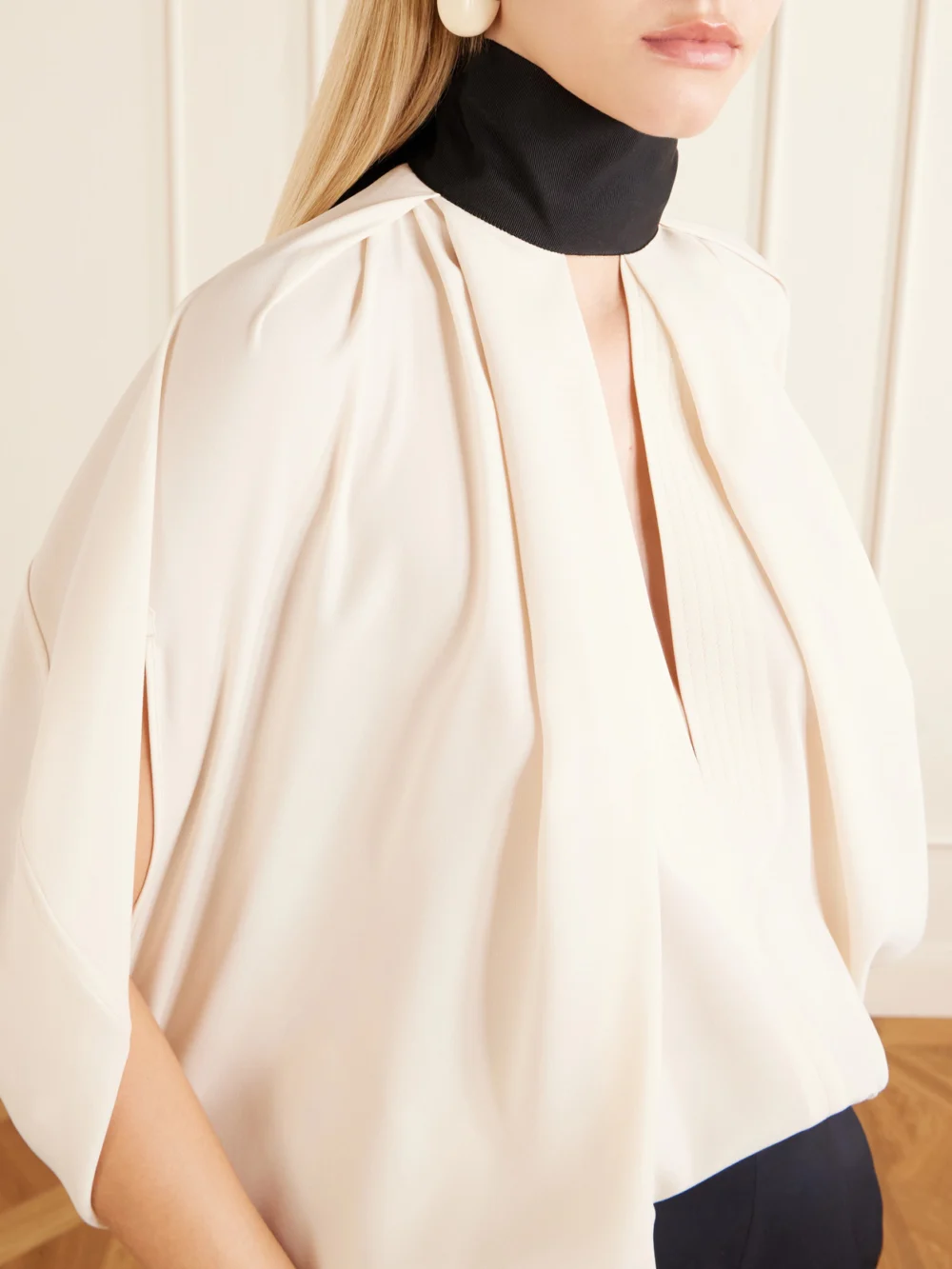 Close-up detail of the Lanvin Bow-detailed Crepe Halterneck Blouse