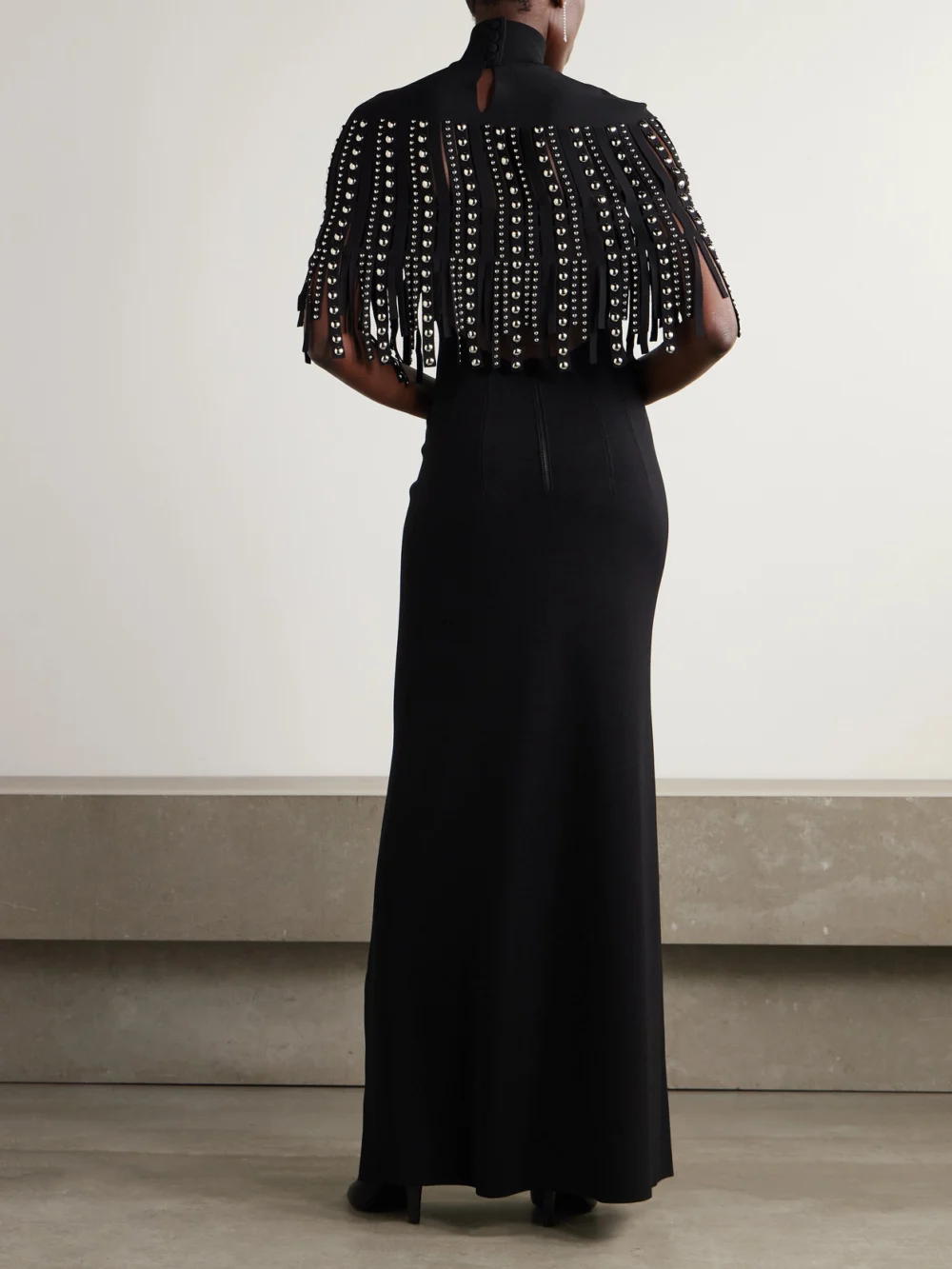 Back view of the Lanvin Fringed Cape-effect Studded Knitted Turtleneck Gown