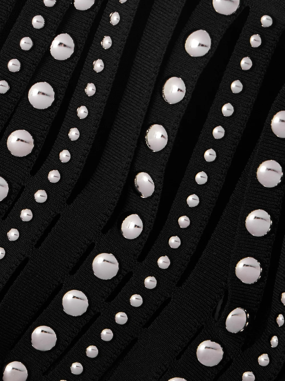 Close-up detail of the Lanvin Fringed Cape-effect Studded Knitted Turtleneck Gown
