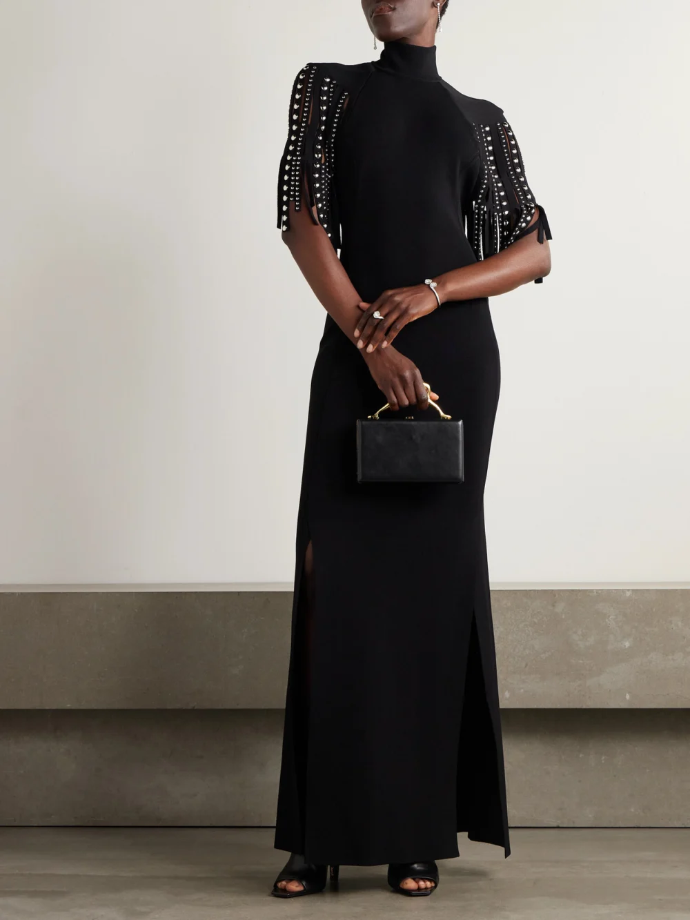Lanvin Fringed Cape-effect Studded Knitted Turtleneck Gown, worn by a model