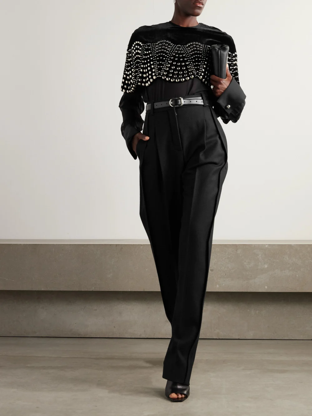 Lanvin Pleated Wool Tapered Pants, worn by a model