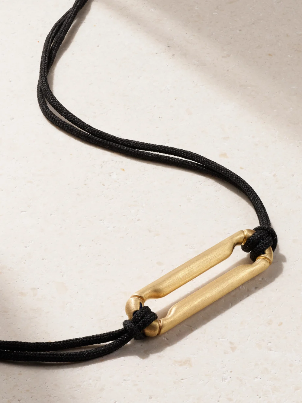 Close-up detail of the Lauren Rubinski 14-karat Gold and Cord Necklace