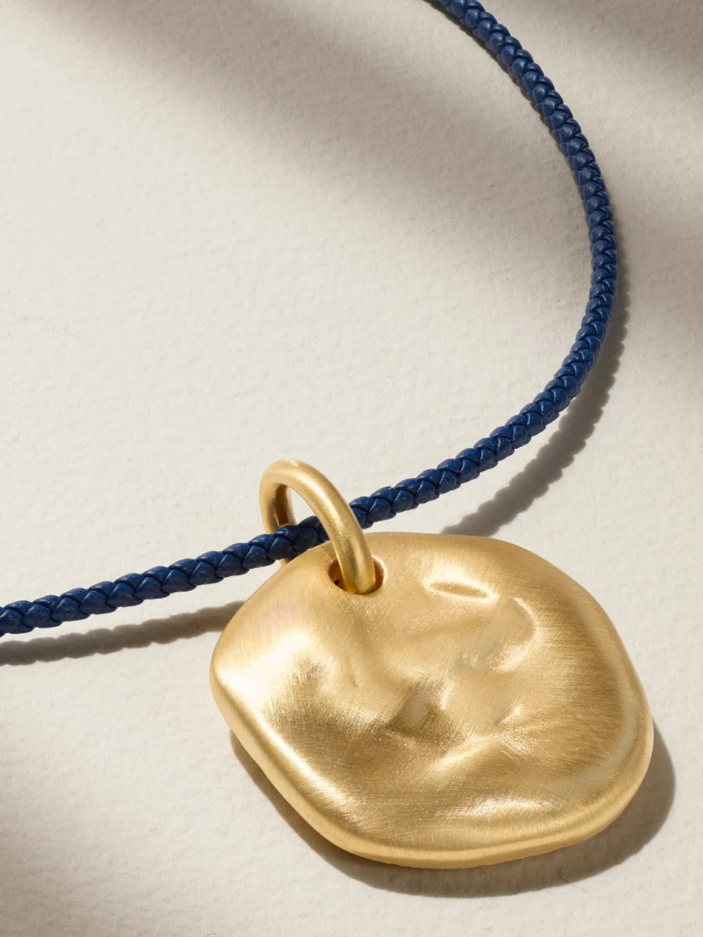 Close-up detail of the Lauren Rubinski 14-karat Gold Leather Necklace