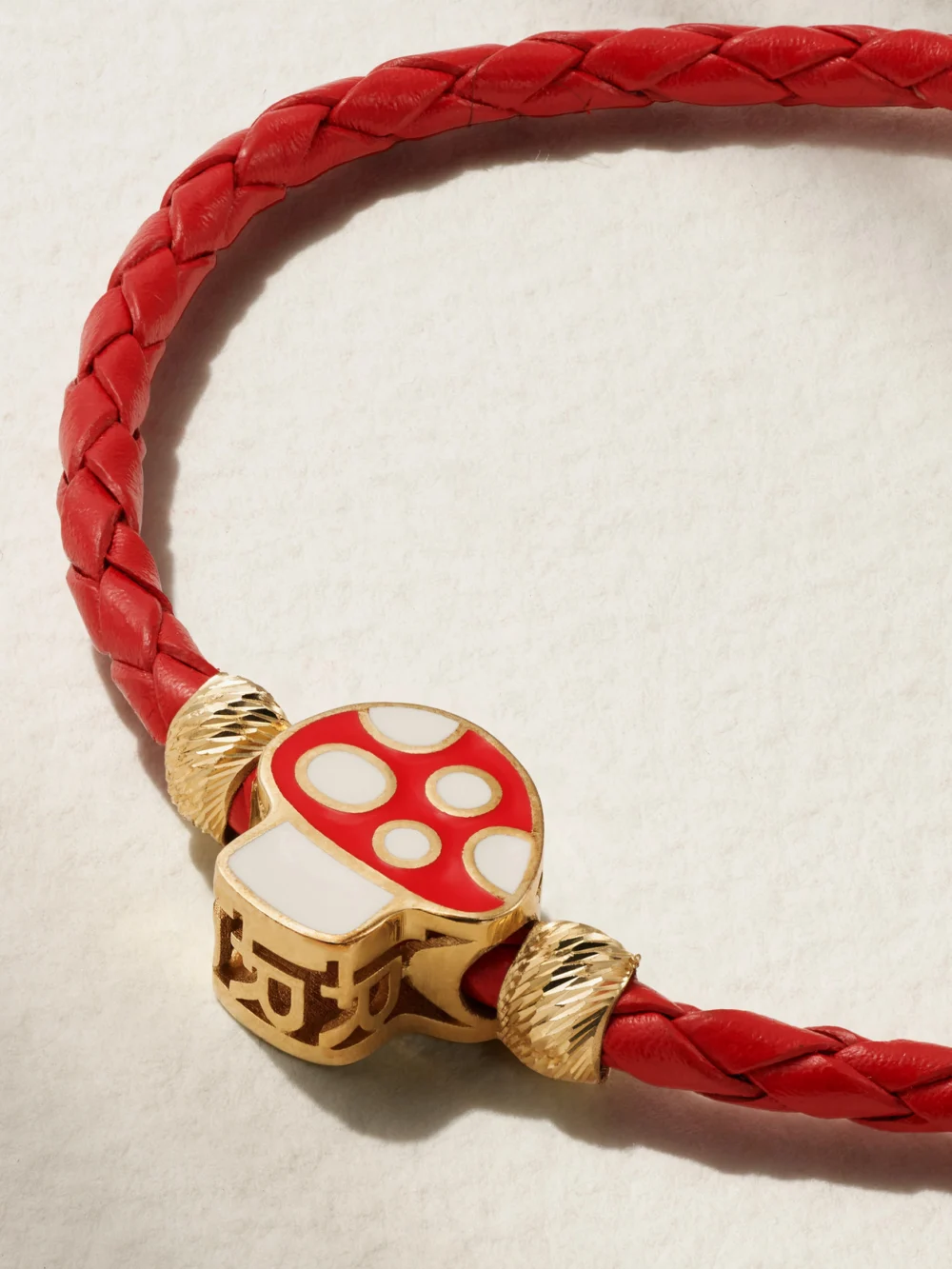 Close-up detail of the Lauren Rubinski Mushroom 14-karat Gold, Enamel and Leather Bracelet