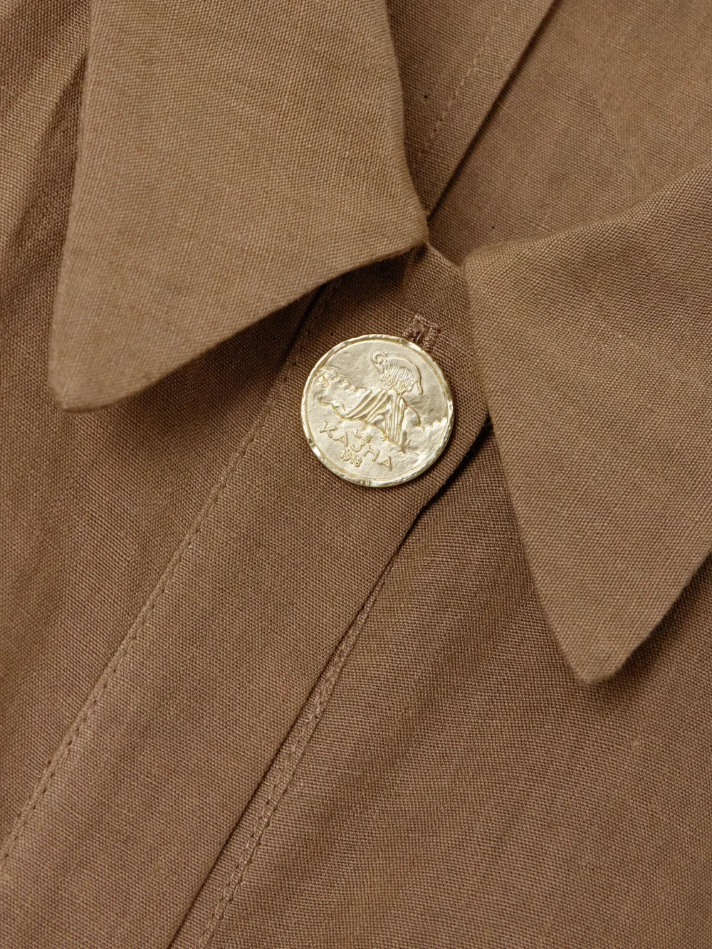 Close-up detail of the Le Kasha Awland Belted Linen Mini Dress