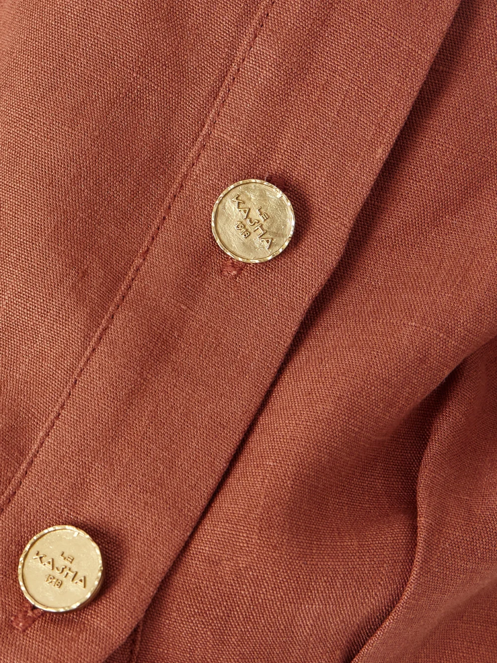 Close-up detail of the Le Kasha Tamra Cropped Organic Linen-gauze Top