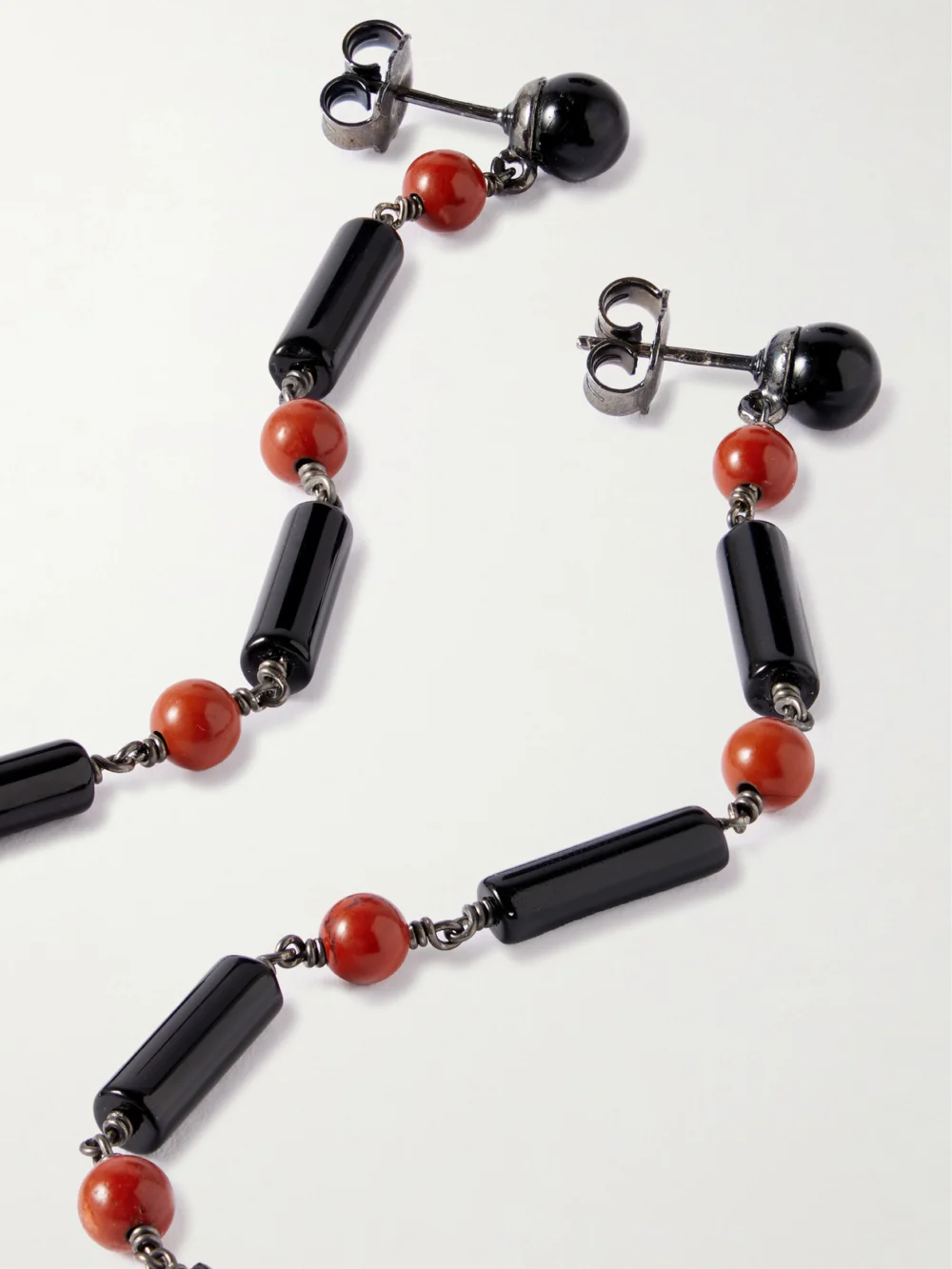 Close-up detail of the Le Sundial Beaded Onyx and Jasper Earrings