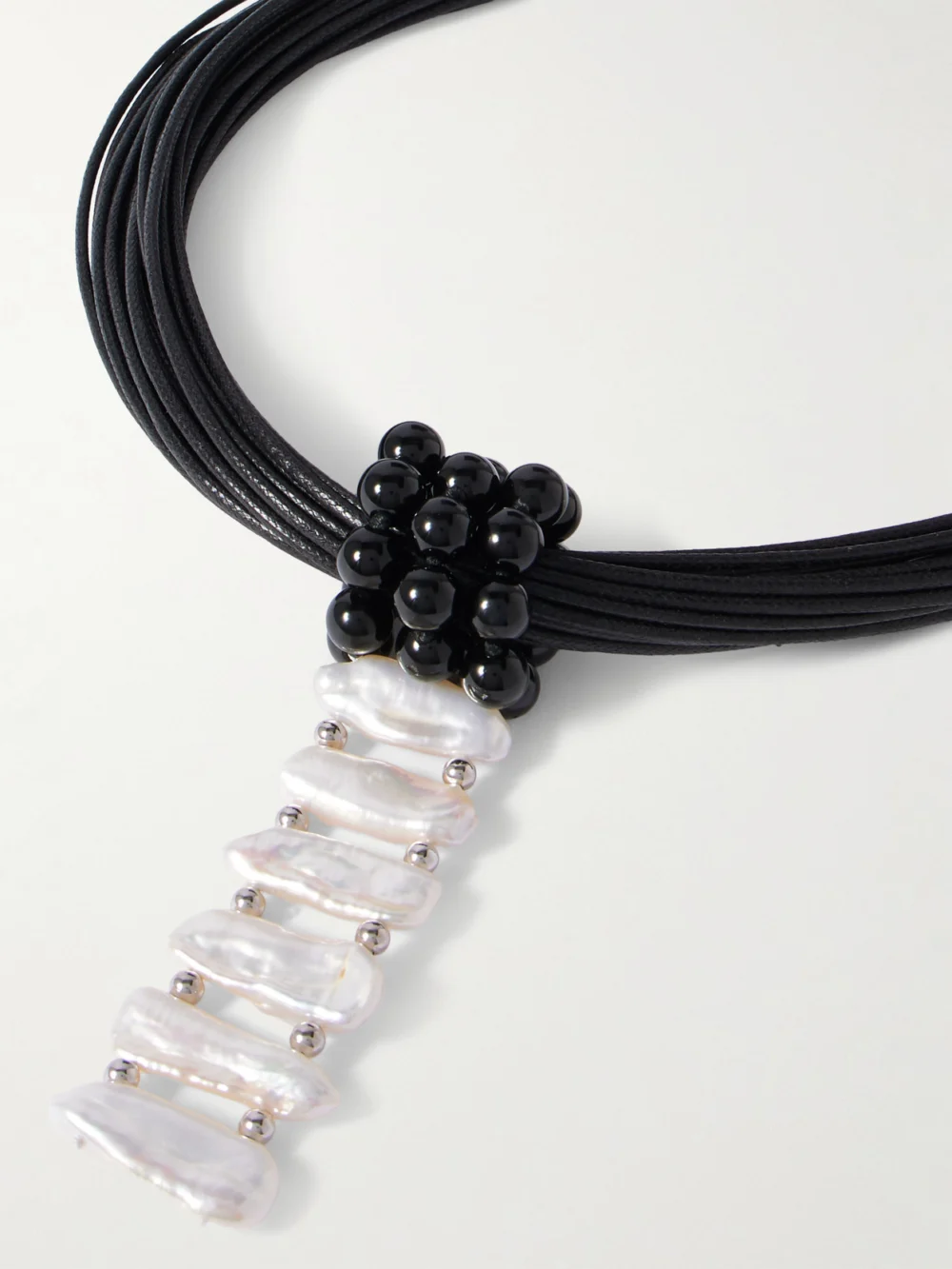 Close-up detail of the Le Sundial Cord, Onyx, Pearl and Silver Necklace