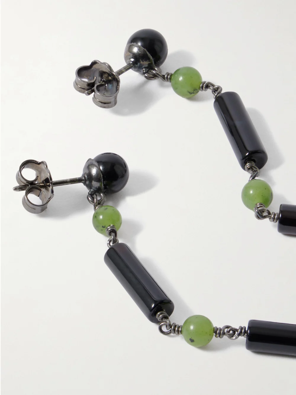Close-up detail of the Le Sundial Jackie Rhodium-plated Jade and Onyx Earrings