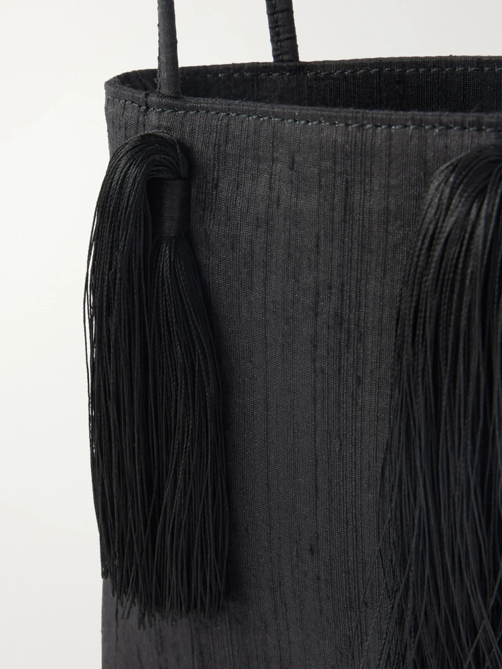 Close-up detail of the Le Sundial Le Salon Tasseled Dupioni Clutch