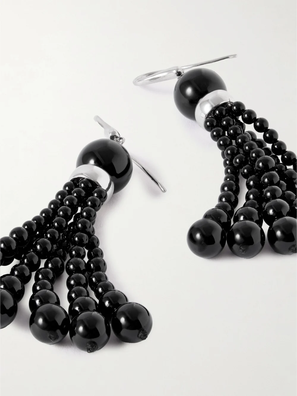 Close-up detail of the Le Sundial Venice Opera Tasseled Onyx Earrings
