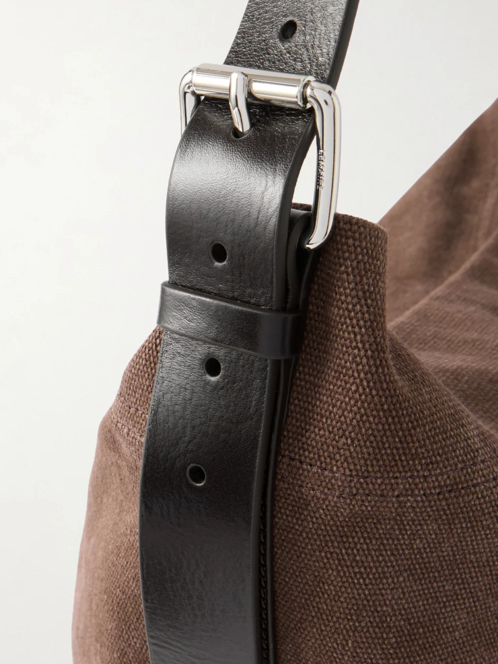 Close-up detail of the Lemaire Belted Leather-trimmed Canvas Tote