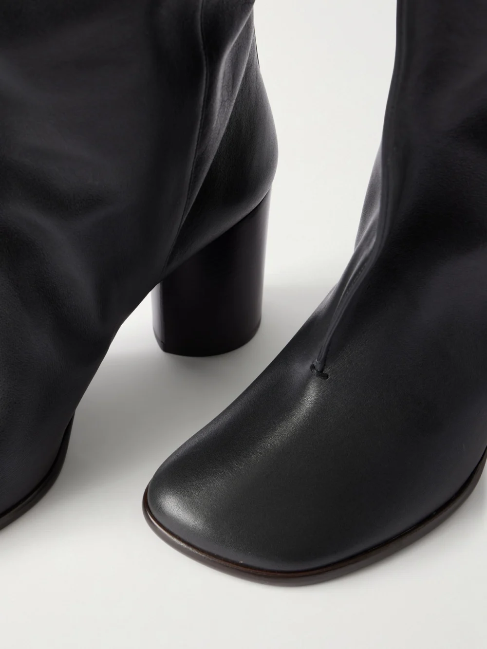 Close-up detail of the Lemaire Crease Leather Knee Boots