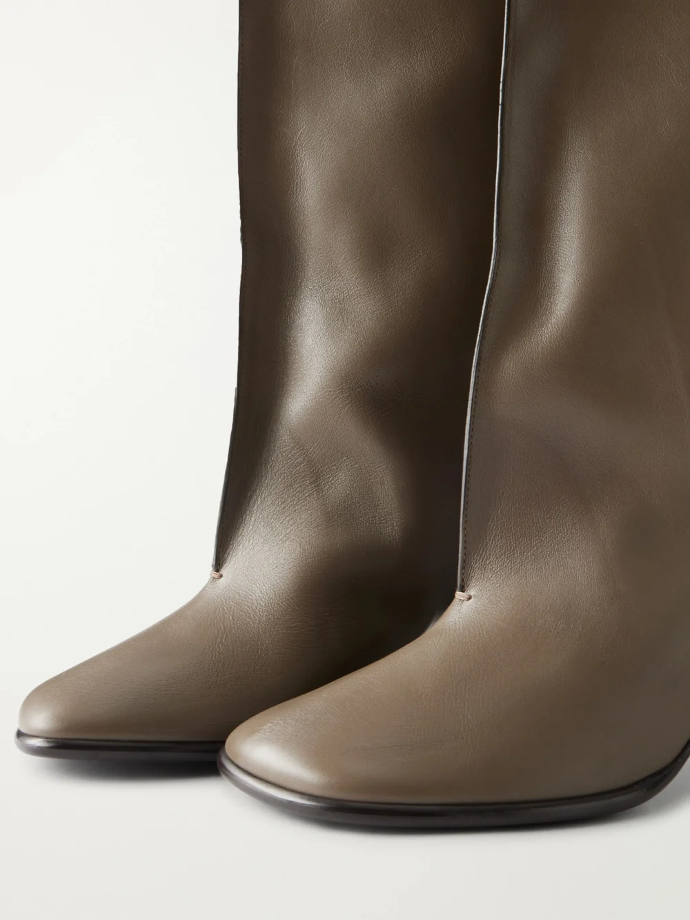 Close-up detail of the Lemaire Crease Leather Knee Boots