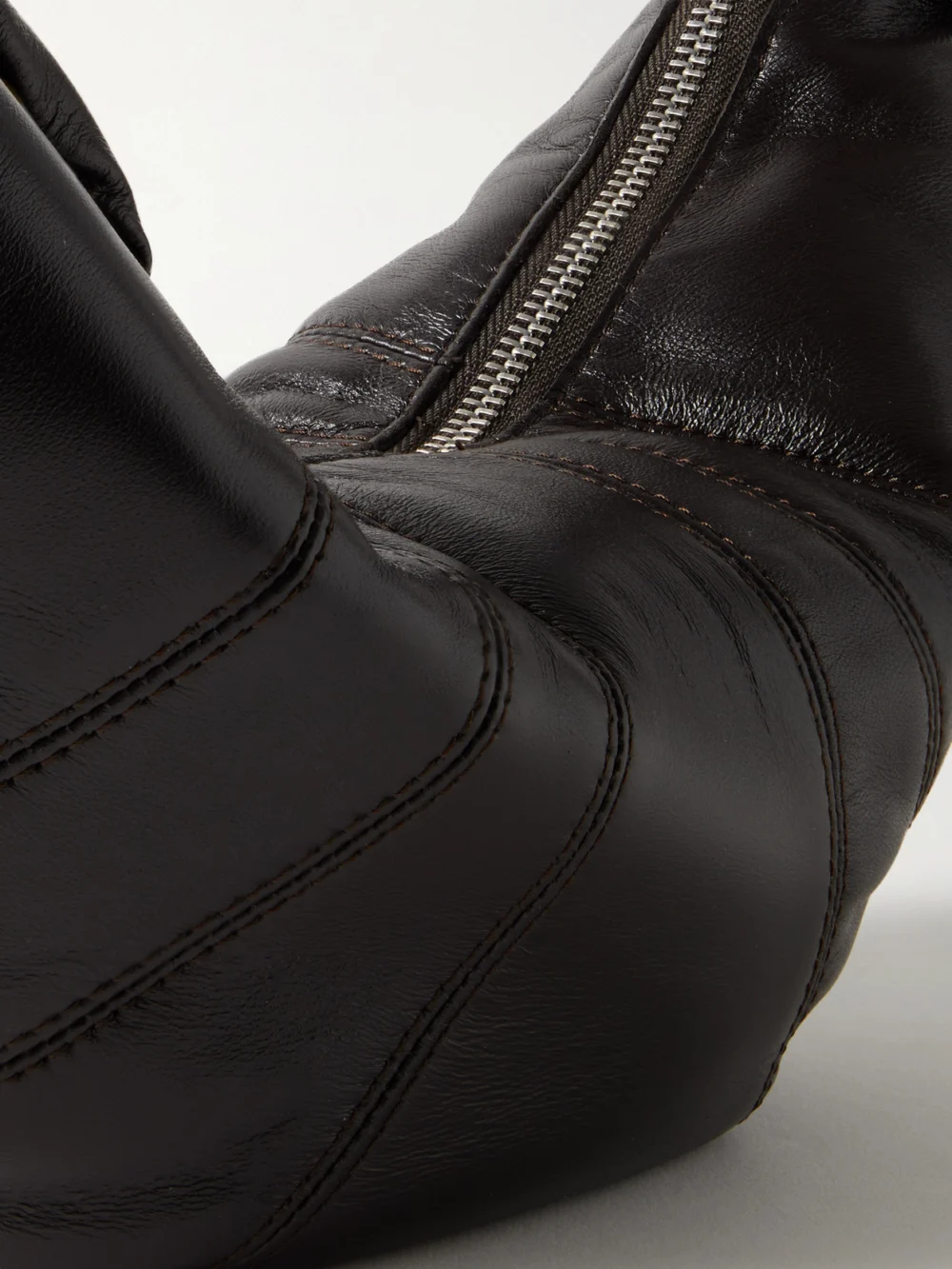 Close-up detail of the Lemaire Croissant Small Paneled Leather Shoulder Bag