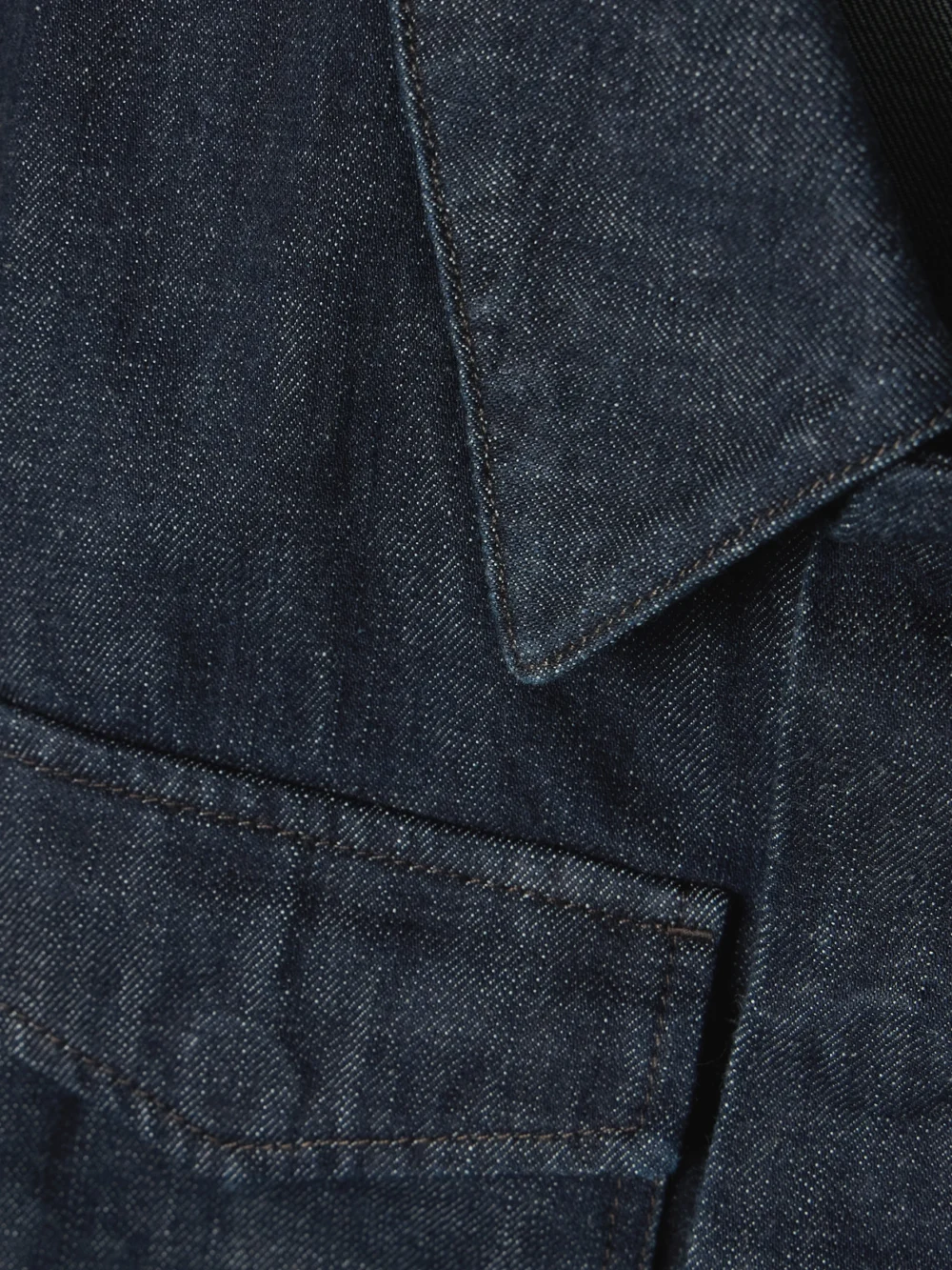 Close-up detail of the Lemaire Cropped Denim Jacket