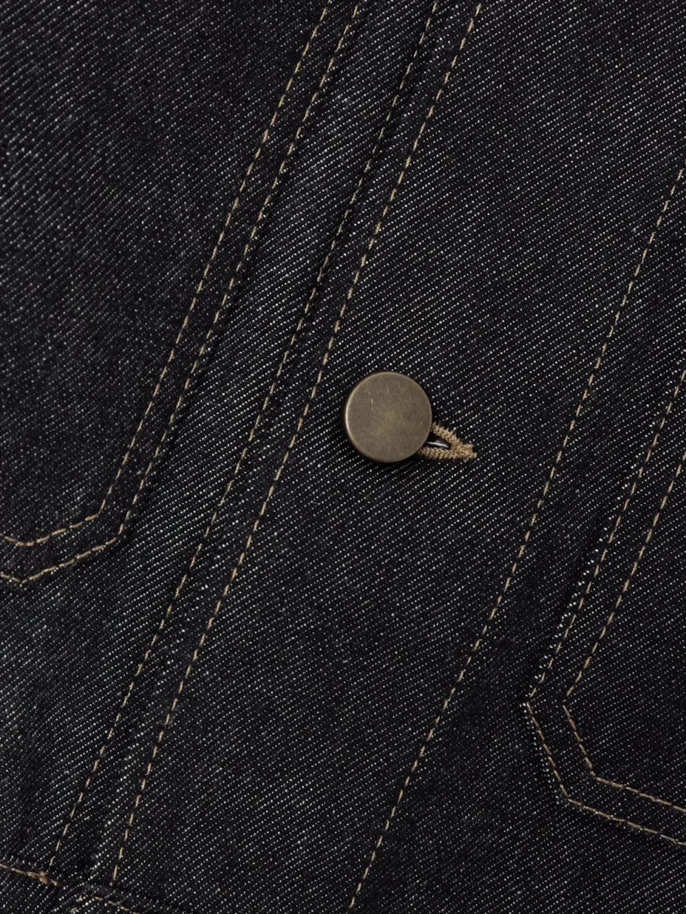 Close-up detail of the Lemaire Cropped Organic Denim Jacket