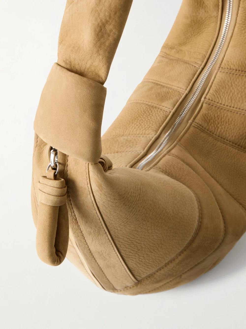 Close-up detail of the Lemaire Fortune Croissant Paneled Nubuck Shoulder Bag