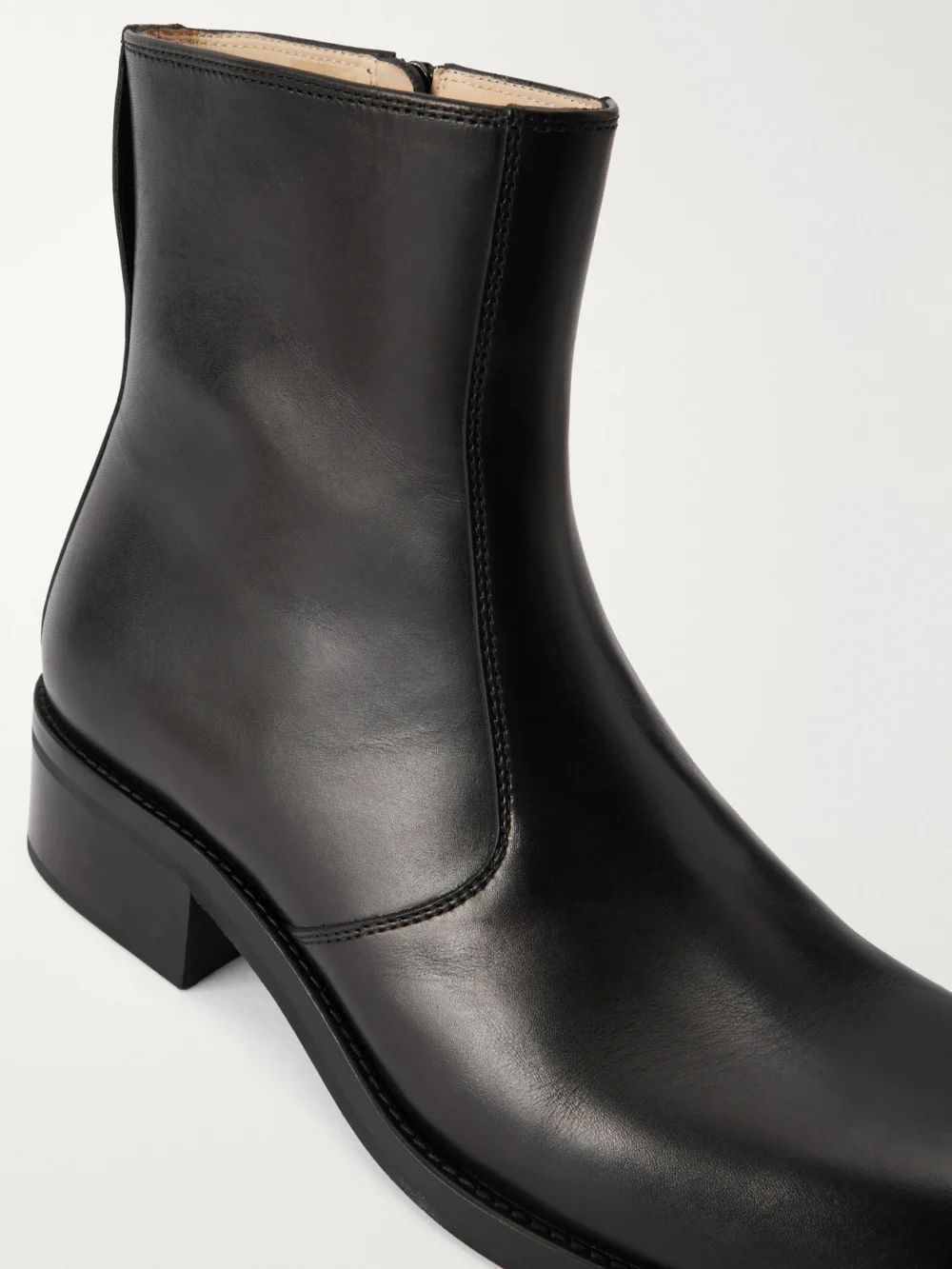 Close-up detail of the Lemaire Leather Ankle Boots