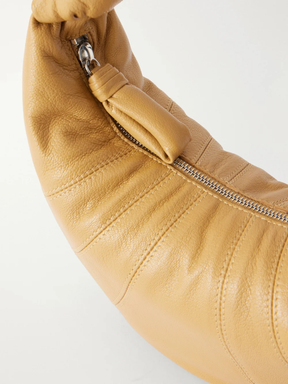 Close-up detail of the Lemaire Mini Fortune Croissant Paneled Leather Shoulder Bag