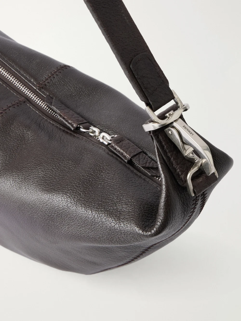 Close-up detail of the Lemaire Quiver Clip Mini Paneled Full-grain Leather Shoulder Bag