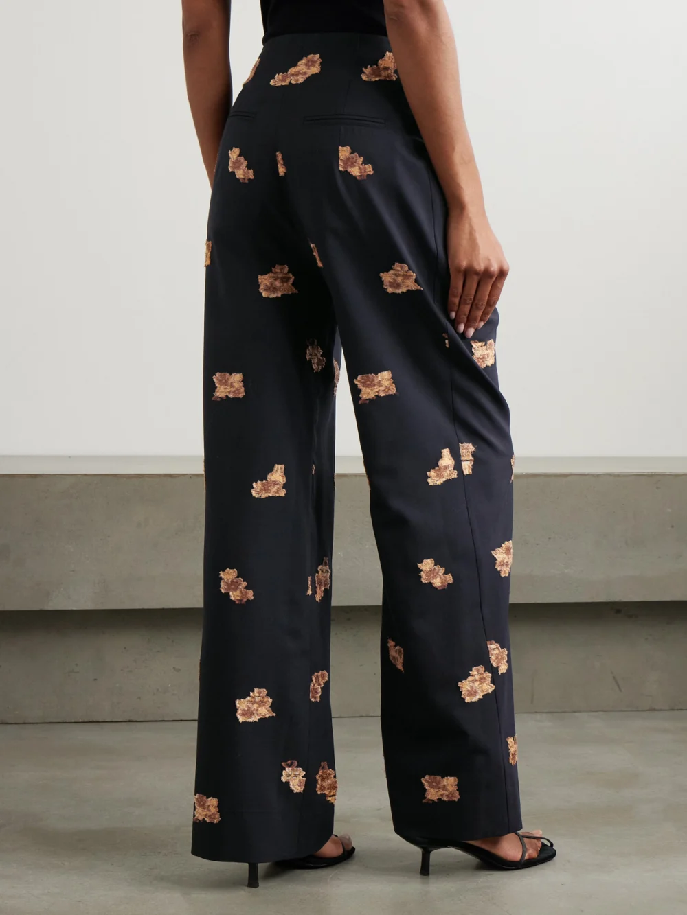 Back view of the Liberowe Annie Pleated Floral-jacquard Metallic Wool-blend Wide-leg Pants