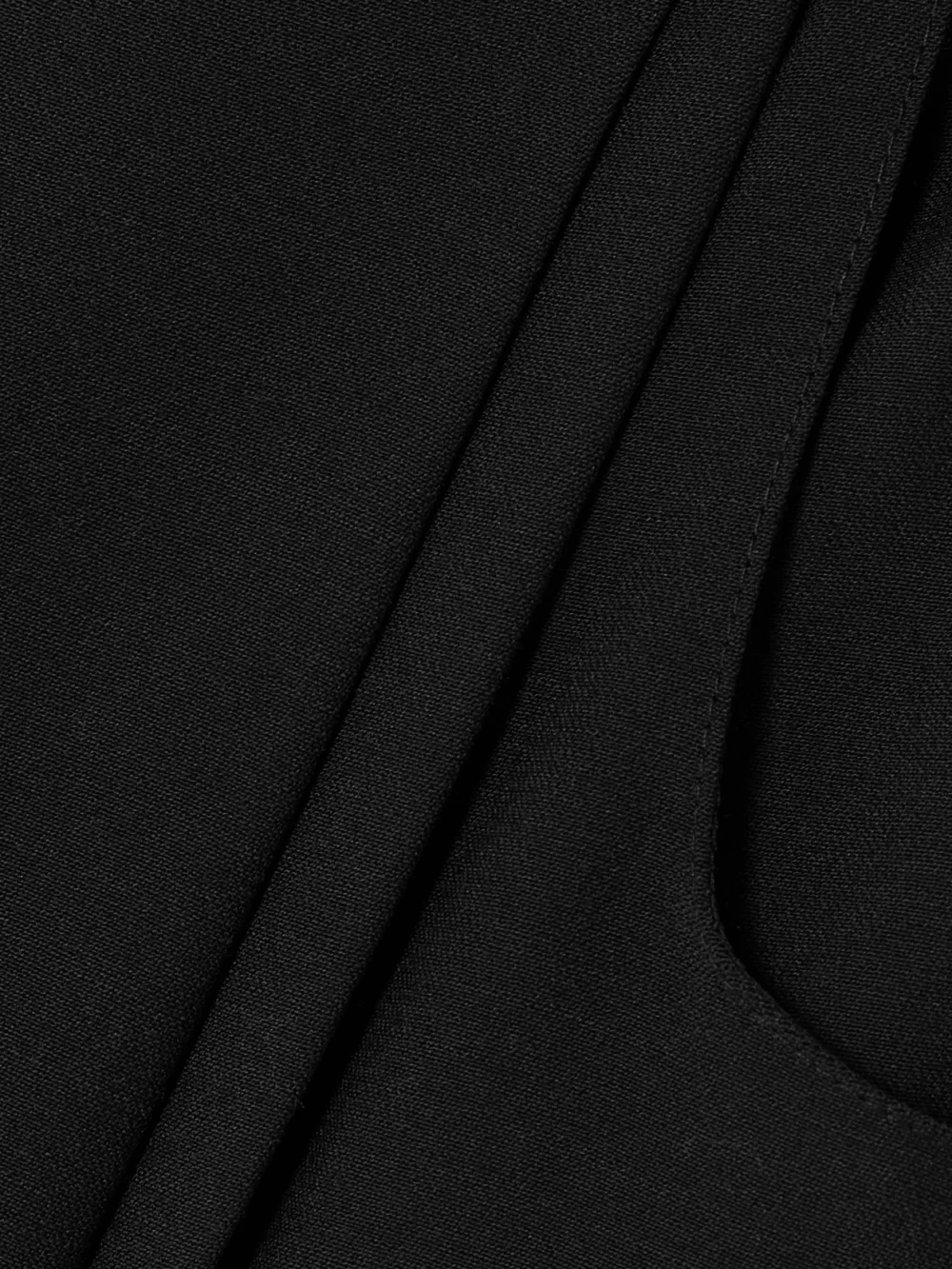 Close-up detail of the Liberowe Annie Pleated Wool Wide-leg Pants