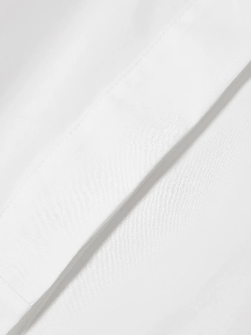 Close-up detail of the Liberowe Cropped Cotton-poplin Shirt