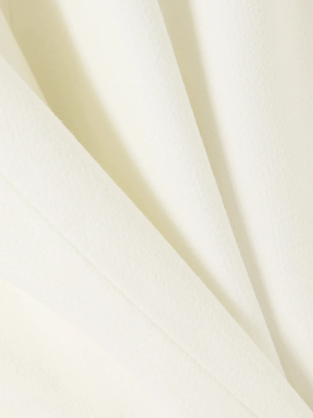 Close-up detail of the Liberowe + the Vanguard Amber Wool-crepe Mini Dress